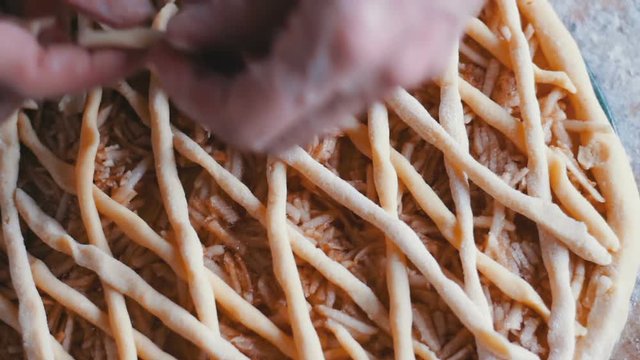 Cook decorates apple pie