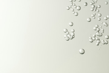 Light champagne bubbles soars over a blurred background