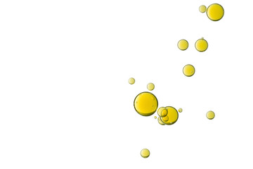 A group of yellow fizz bubbles is isolated over a white background