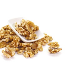 Close - up edible seeds walnut on white background