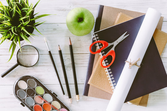 School books on wooden table, education concept