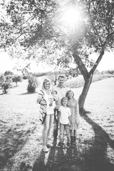 Fototapeta premium happy young family with 3 children outdoors
