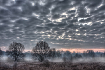 sunrise with dark sky