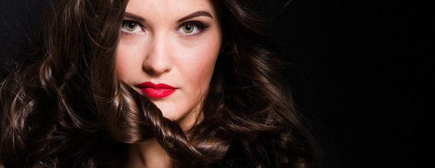 Fototapeta premium Portrait of a woman with red lipstick