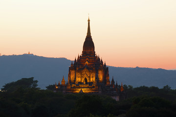 The peak of the ancient Buddhist temple of Gawdaw Palin at sunset. Bagan, Myanmar