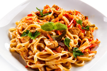 Rice noodles with meat, sauce and vegetables