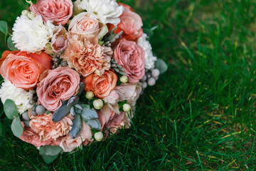 Wedding bouquet on grass with copy space