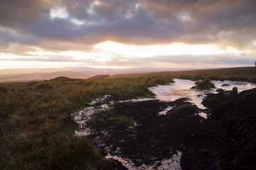 A winter sunset over a frozen bog in the Brecon Beacons