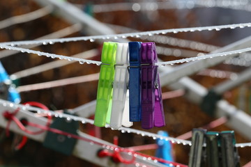 Close up of a colored clothespins on a clothesline