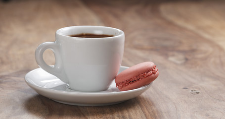 cup of fresh espresso with macaroon on table with copy space, 4k unedited photo