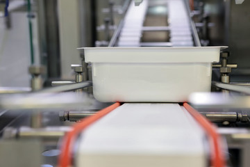 Sterile capsules for injection. Bottles on the bottling line of the pharmaceutical plant. Machine after checking sterile liquids. Interferon, nasoferon.