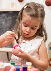 Little girl with Easter eggs