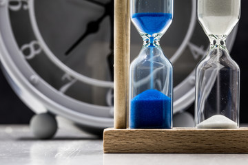 table clock with sand closeup