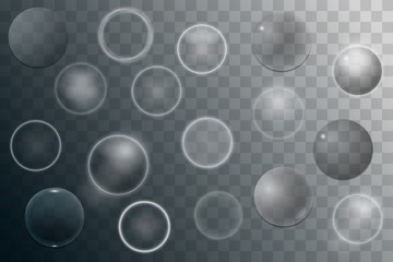 Collection of transparent glass spheres with glares and highlights.