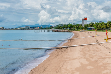 Shark and stinger nets on The Strand beach, Townsville, Australia, with lifeguard
