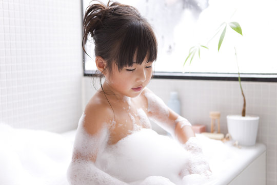 Girl taking a bubble bath