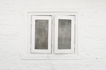 White window and white brick wall