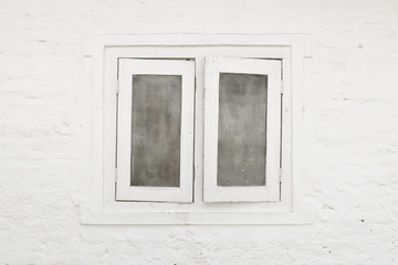 White window and white brick wall