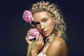 Beautiful girl with peony flower