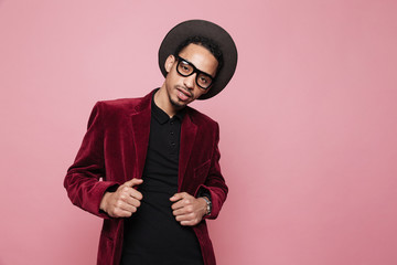 Handsome stylish african man standing and looking at camera
