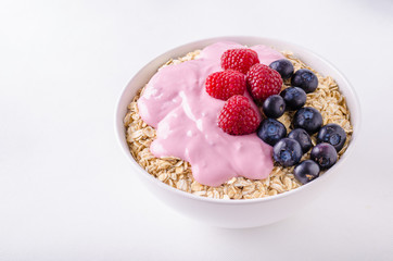 Oatmeat in bowl with yogurt and berries