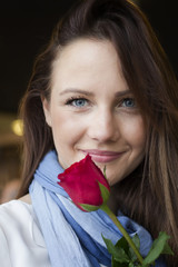 Portrait of beautiful young girl with rose