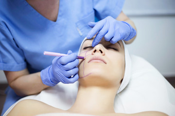 Cosmetic treatments for the skin in the beauty salon. Woman in spa salon