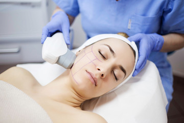 Cosmetic treatments for the skin in the beauty salon. Woman in spa salon