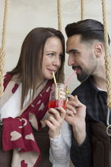 Young couple looking each other on eyes