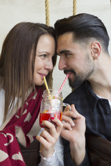 Young couple looking each other on eyes