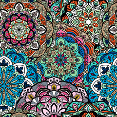 Seamless ethnic pattern with floral motives. Mandala stylized print template for fabric and paper. Indian or Arabic motive. Boho festival style.