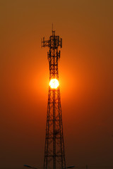 Mobile phone transmitter in the evening, the sun is down, and inside the transmission tower.