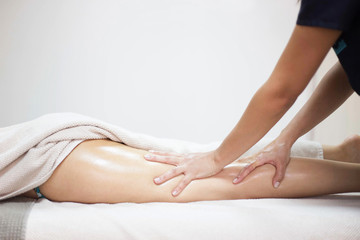 Anti cellulite massage for young woman in beauty salon - obrazy, fototapety, plakaty