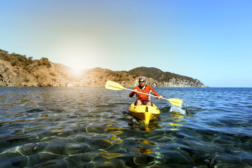 Travel by sea kayak on a sunny day.