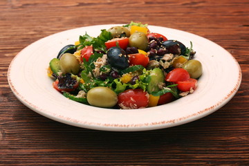 Tuna salad with cherry tomatoes, beans and olives. Low fat eating concept.