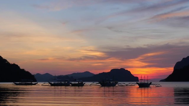 
00:01 | 00:19
1&times;

Filippino boats at sunset lights. Palawan island, El Nido bay. Philippines.