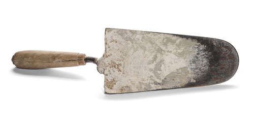Old rusty and dirty metal trowel, isolated on white background - obrazy, fototapety, plakaty