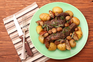 Beef roasted with potatoes, chestnuts, apples. Healthy eating concept