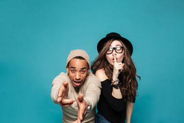 Portrait of a cheerful young couple dancing and having party