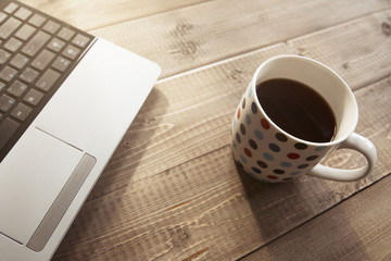 Laptop and coffee mug
