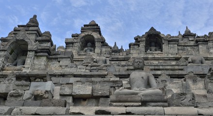Borobudur Buddist Temple in island Java Indonesia. Detail of Buddhist carved relief in Borobudur temple in Yogyakarta, Java, Indonesia..