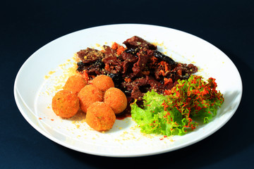 Appetizing salad. Meat and Croquettes
