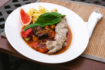 Fototapeta premium plate with grilled vegetables, meat and greens