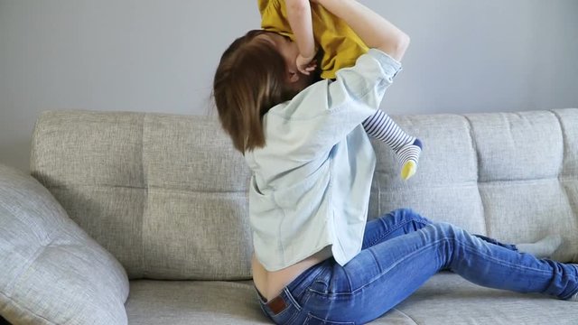 Mother and her baby girl kissing and hugging. Resting together. Family concept. Full Hd Slow Motion Stock Footage.
