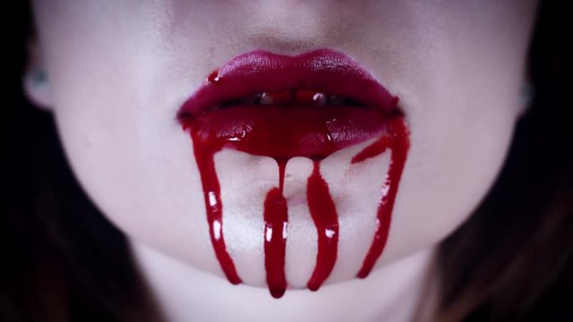 4K Horror Close-Up of Vampire Red Lips with Blood Dripping