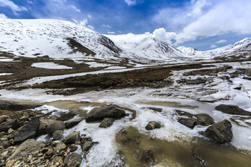 Fototapeta na wymiar Along way at Khardung La Pass in Ladakh, India. Khardung La is a high mountain pass located in the Ladakh region of the Indian state of Jammu and Kashmir. The elevation of Khardung La is 5,359 m.