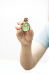 hand holding a vintage pocket clock