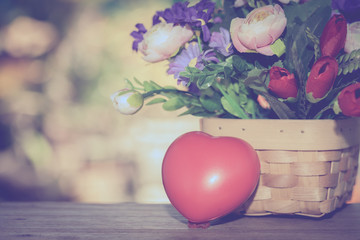 red heart with basket of flower plant
