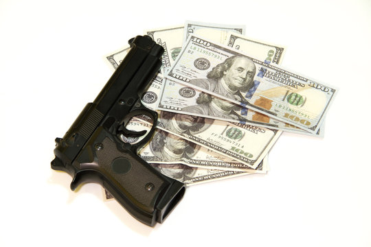 Black gun and one hundred dollars