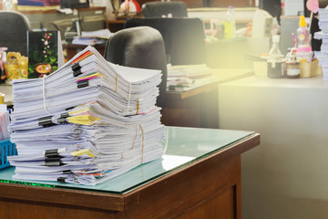 Pile of documents on desk at workplace